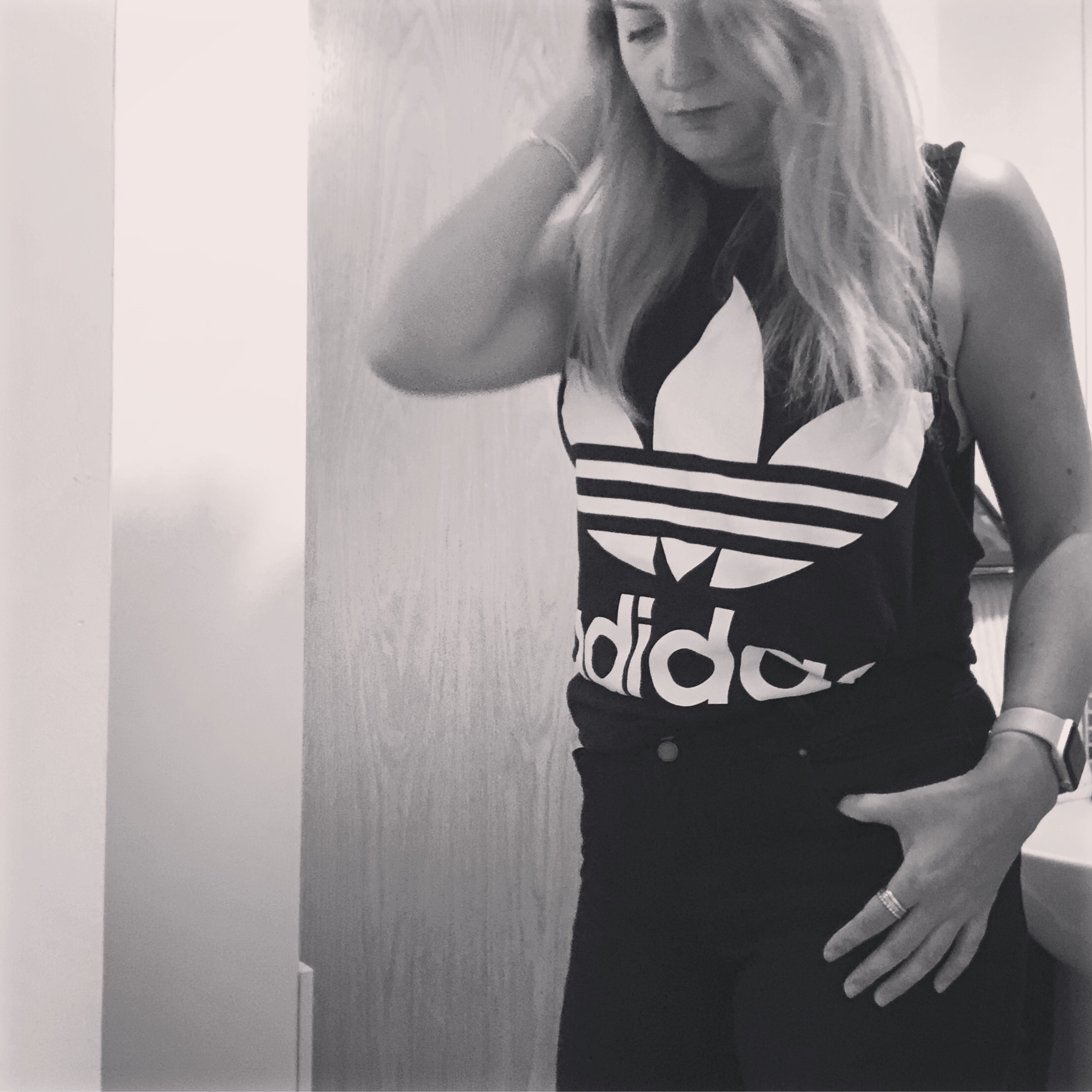 A picture of me posing wearing an Adidas tank top